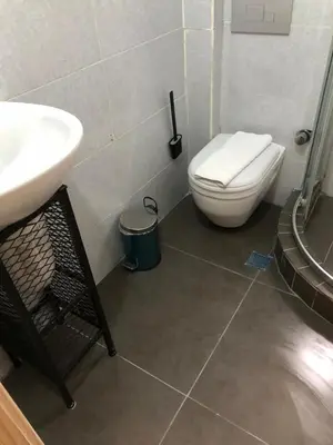 a bathroom with a white toilet and a sink at Kilit no 1 in Istanbul