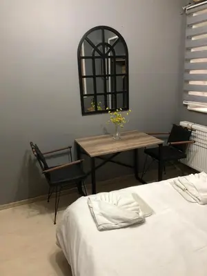 a dining room with a table and a table and chairs at Kilit no 1 in Istanbul