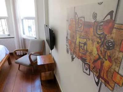 a living room with a painting on the wall at Istanberry - Luna Apartments in Istanbul